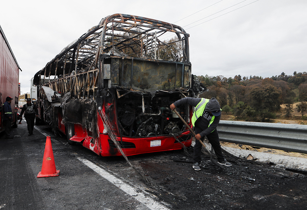 A burned bus is seen Feb. 22, 2026, at the site of a highway in Santa Rita Tlahuapan, Mexico, that connects Mexico City with the state of Puebla. Members of organized crime in several states put up roadblocks and carried out arson attacks after a military operation in which Mexican drug lord Nemesio Oseguera, known as "El Mencho," was killed in Tapalpa in Mexico's Jalisco state. (OSV News/Reuters/Paola Garcia)