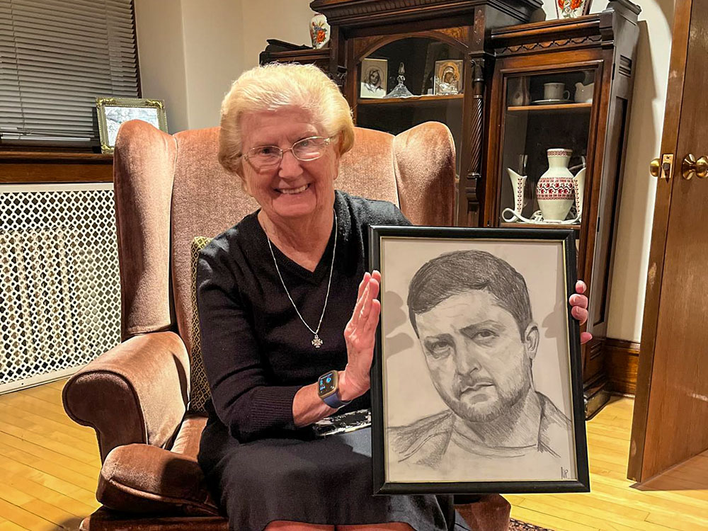 Basilian Sr. Dorothy Ann Busowski proudly displays a gift from a friend — a framed hand-drawn portrait of Ukrainian President Volodymyr Zelenskyy. (Courtesy of the Sisters of St. Basil)
