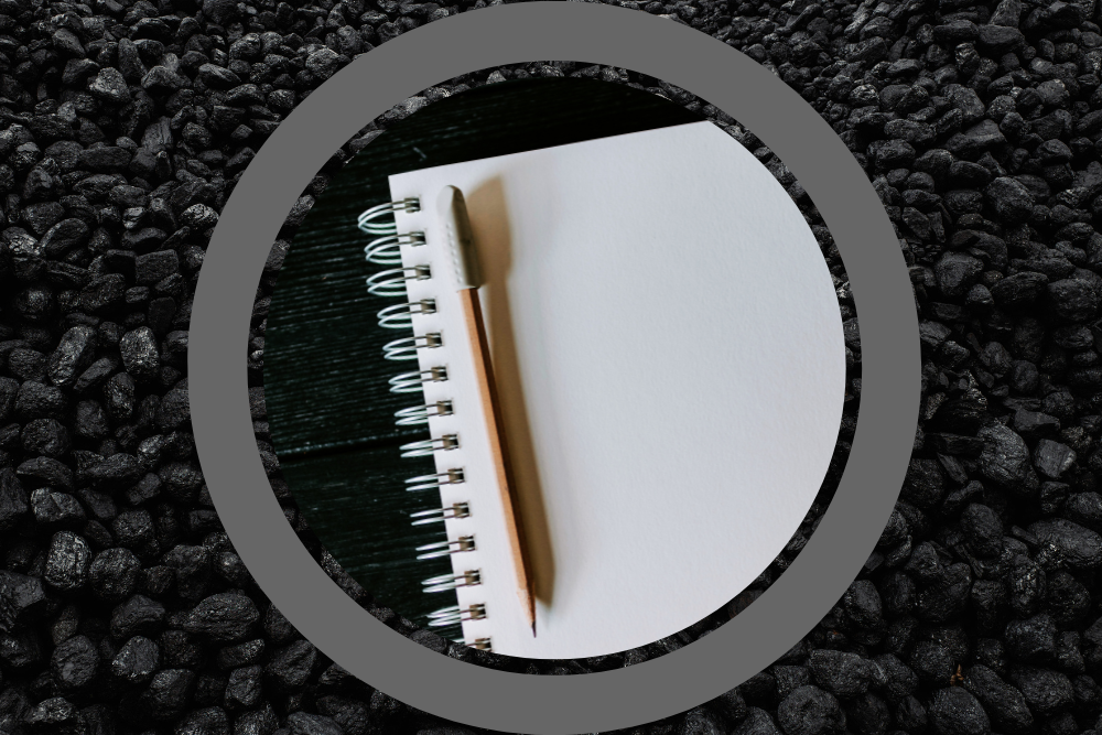 Photo of a notebook with a pencil on a background photo of coal (GSR graphic/Unsplash photos/Kelly Sikkema, Ottr Dan)