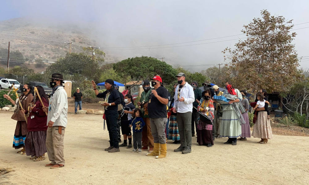Apache Stronghold, a coalition of Apaches, other Native peoples and non-Native supporters seeking to preserve Oak Flat, arrives at Wishtoyo Chumash Village to begin a ceremonial circle, Sunday, Oct. 17, in Malibu, California. (RNS photo/Alejandra Molina) Apache Stronghold, a coalition of Apaches, other Native peoples and non-Native supporters seeking to preserve Oak Flat, arrives at Wishtoyo Chumash Village to begin a ceremonial circle, Sunday, Oct. 17, in Malibu, California. (RNS photo/Alejandra Molina)