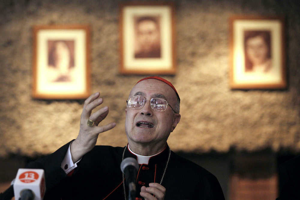 Cardinal Tarcisio Bertone, then-Vatican secretary of state, gestures during a news conference in Santiago, Chile, April 12, 2010. (CNS/Reuters/Ivan Alvarado) Cardinal Tarcisio Bertone, then-Vatican secretary of state, gestures during a news conference in Santiago, Chile, April 12, 2010. (CNS/Reuters/Ivan Alvarado)