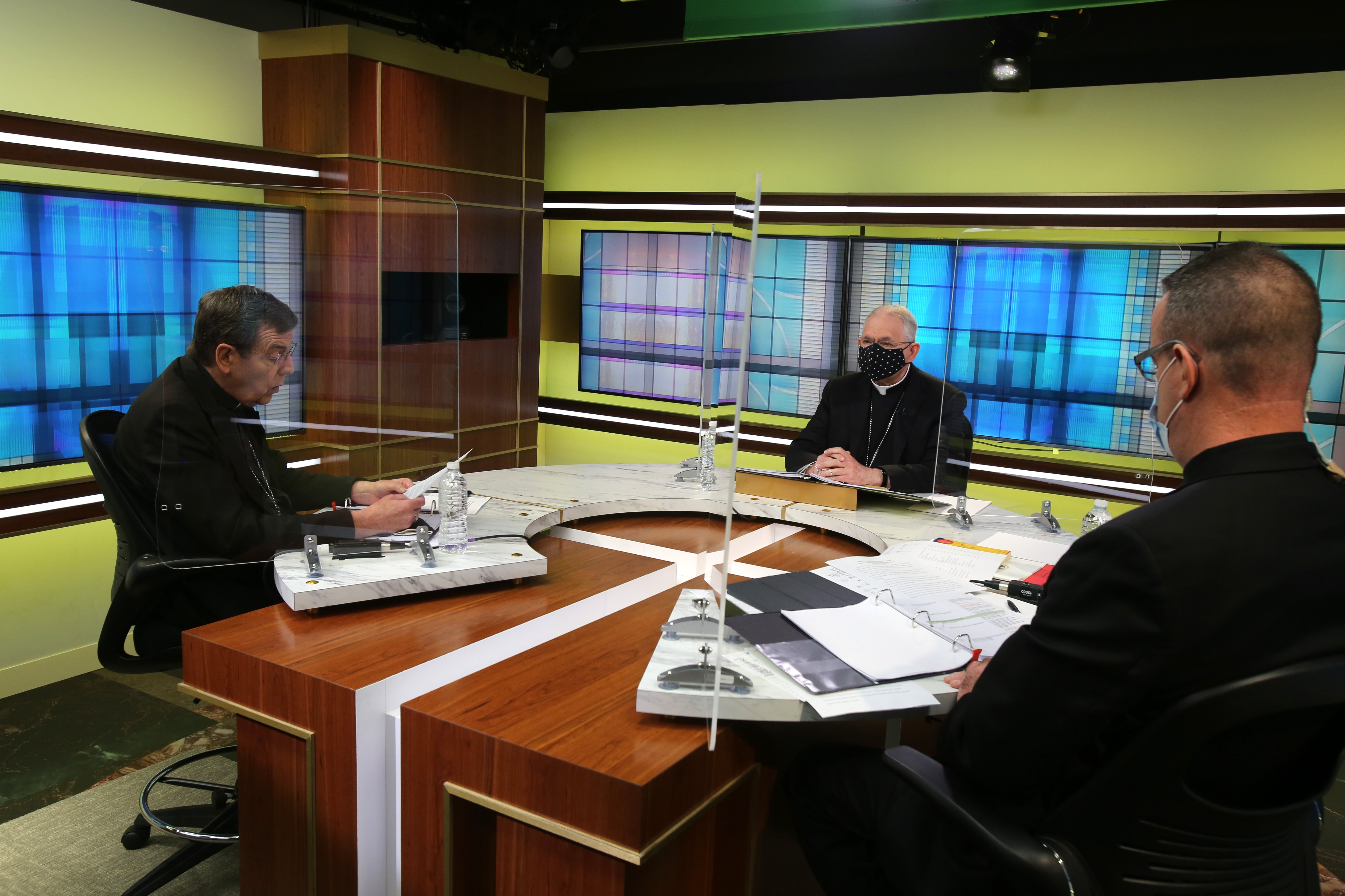Detroit Archbishop Allen Vigneron, vice president of the U.S. Conference of Catholic Bishops, left, leads the opening prayer Nov. 17 at the conference's headquarters in Washington during the bishops' virtual fall meeting. Also pictured are Archbishop Jose Detroit Archbishop Allen Vigneron, vice president of the U.S. Conference of Catholic Bishops, left, leads the opening prayer Nov. 17 at the conference's headquarters in Washington during the bishops' virtual fall meeting. Also pictured are Archbishop Jose