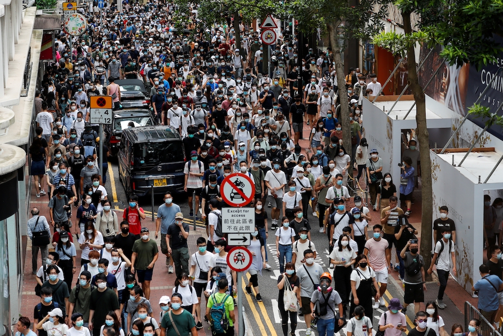 Demonstrators march during a protest against the national security law in Hong Kong July 1. (CNS/ Reuters/Tyrone Siu) Demonstrators march during a protest against the national security law in Hong Kong July 1. (CNS/ Reuters/Tyrone Siu)