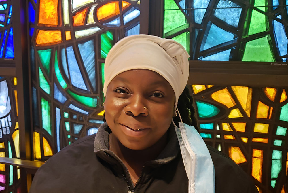 Veronica Garcia at her home parish, St. Frances of Rome Church in the Bronx, New York City. Cabrini Immigrant Services' legal services helped Garcia settle her immigrant status, and she receives food twice a month as one of the agency's regular clients. ( Veronica Garcia at her home parish, St. Frances of Rome Church in the Bronx, New York City. Cabrini Immigrant Services' legal services helped Garcia settle her immigrant status, and she receives food twice a month as one of the agency's regular clients. (