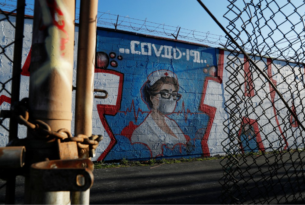 A mural of a health care worker is seen in Chicago April 21 during the coronavirus pandemic. "My conversations with local officials is simply this: Tell us what you need, and we'll see what we can do," says Chicago Cardinal Blase Cupich. (CNS/Reuters) A mural of a health care worker is seen in Chicago April 21 during the coronavirus pandemic. "My conversations with local officials is simply this: Tell us what you need, and we'll see what we can do," says Chicago Cardinal Blase Cupich. (CNS/Reuters)