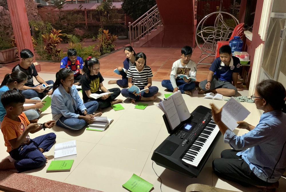 Lovers of the Holy Cross Sr. Hill Pen leads choir practice on a Saturday evening at the Catholic church in Stung Treng, Cambodia, earlier this year. (Akarath Soukhaphon) Lovers of the Holy Cross Sr. Hill Pen leads choir practice on a Saturday evening at the Catholic church in Stung Treng, Cambodia, earlier this year. (Akarath Soukhaphon)