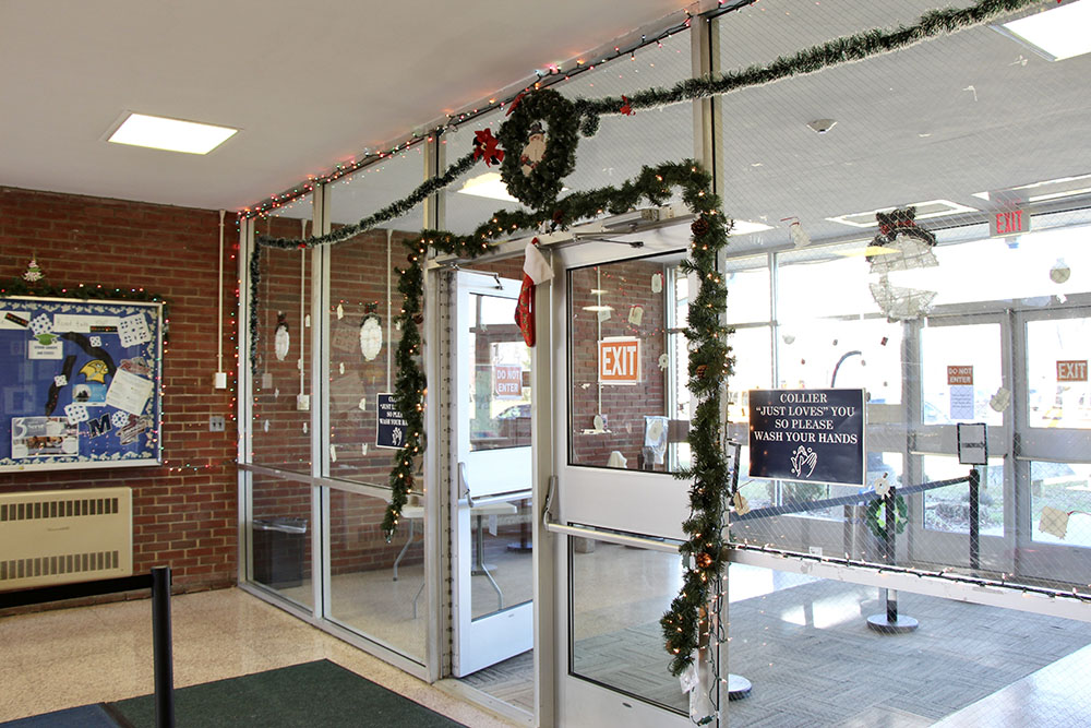 Collier High School's lobby is decorated to celebrate the holidays. Staff members go out of their way to celebrate the students' different traditions, and a festive lobby is one way they make this happen. (Maddie Thompson) Collier High School's lobby is decorated to celebrate the holidays. Staff members go out of their way to celebrate the students' different traditions, and a festive lobby is one way they make this happen. (Maddie Thompson)
