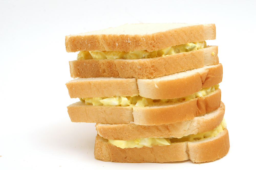 Stack of three egg salad sandwiches on white bread (Dreamstime/Andi Berger) Stack of three egg salad sandwiches on white bread (Dreamstime/Andi Berger)