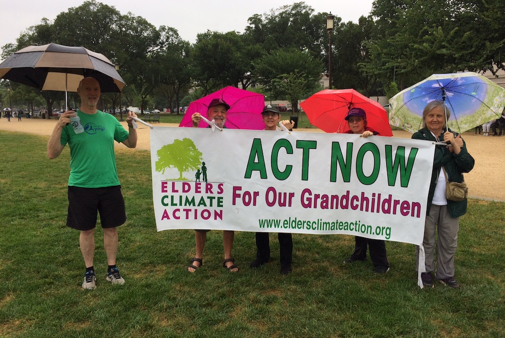 David Mog, second from left, stands with Elders Climate Action co-chair Leslie Wharton, third from left, and other activists represent Elders Climate Action banner at an event in Washington, D.C. July 20, 2018. (Provided photo) David Mog, second from left, stands with Elders Climate Action co-chair Leslie Wharton, third from left, and other activists represent Elders Climate Action banner at an event in Washington, D.C. July 20, 2018. (Provided photo)