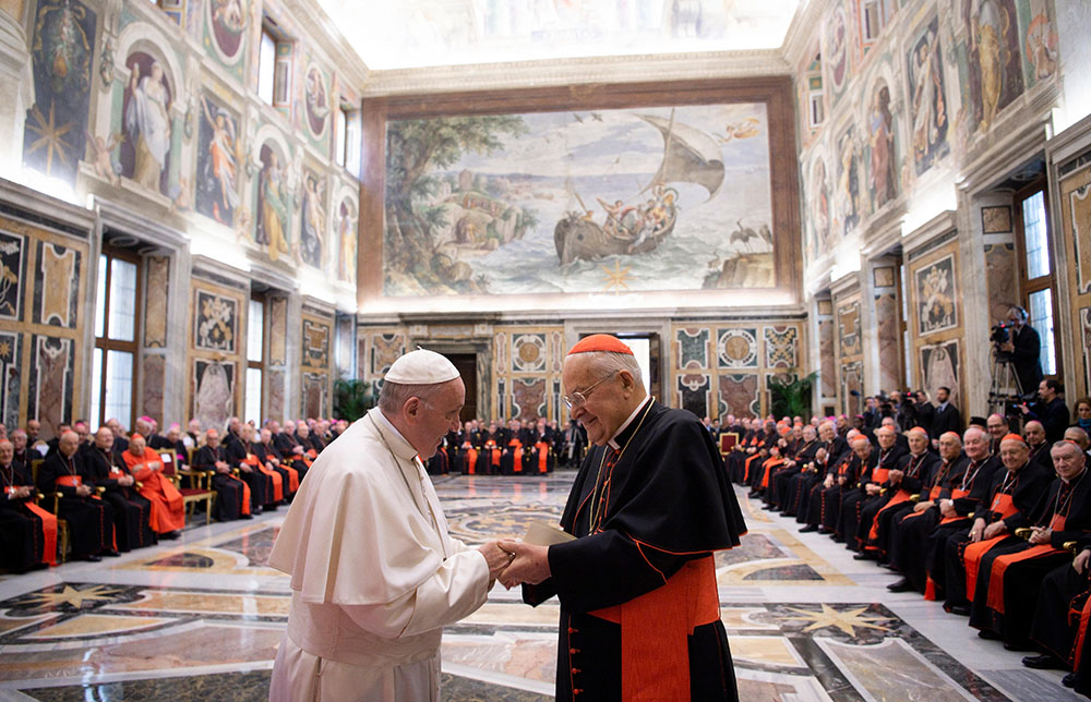 In 2018, Pope Francis greets Cardinal Angelo Sodano, then dean of the College of Cardinals, during the pope's annual pre-Christmas meeting with officials of the Roman Curia and College of Cardinals. (CNS/Vatican Media) In 2018, Pope Francis greets Cardinal Angelo Sodano, then dean of the College of Cardinals, during the pope's annual pre-Christmas meeting with officials of the Roman Curia and College of Cardinals. (CNS/Vatican Media)