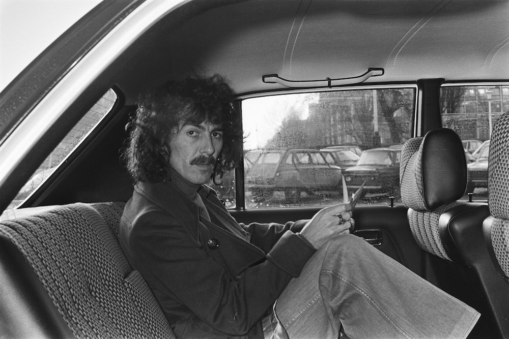 George Harrison is pictured in the back seat of a car as he leaves the Hilton hotel in Amsterdam, the Netherlands, Feb 4, 1977. (National Archives, Anefo collection/Suyk, Koen) George Harrison is pictured in the back seat of a car as he leaves the Hilton hotel in Amsterdam, the Netherlands, Feb 4, 1977. (National Archives, Anefo collection/Suyk, Koen)