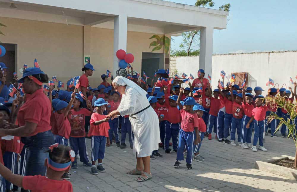 The school celebrates a fiesta de la bandera, Flag Day, each May to honor the Haitian revolution. (Courtesy of Gloria Inés Gonzales Ramírez) The school celebrates a fiesta de la bandera, Flag Day, each May to honor the Haitian revolution. (Courtesy of Gloria Inés Gonzales Ramírez)
