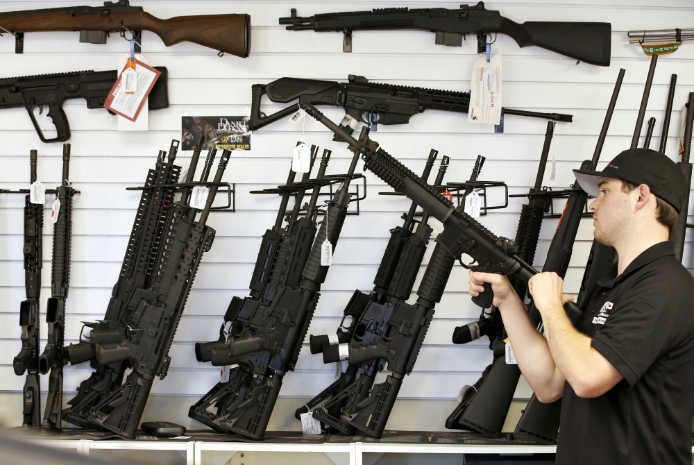 A salesman clears the chamber of an AR-15 in 2016 at a gun store in Provo, Utah. (CNS/Reuters/George Frey) A salesman clears the chamber of an AR-15 in 2016 at a gun store in Provo, Utah. (CNS/Reuters/George Frey)