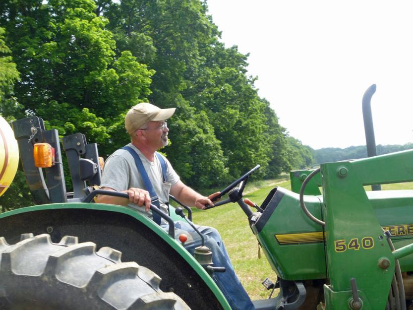 John Moreira, director of land management at Villa Maria Farm, takes the tractor out to one of the farm's many fields. John Moreira, director of land management at Villa Maria Farm, takes the tractor out to one of the farm's many fields.
