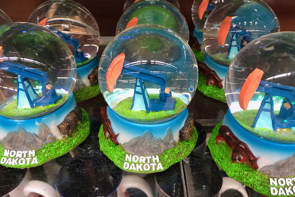 Snow globes for sale in the Fargo, North Dakota, airport gift shop highlight the state's oil industry. (GSR photo/Dan Stockman) Snow globes for sale in the Fargo, North Dakota, airport gift shop highlight the state's oil industry. (GSR photo/Dan Stockman)