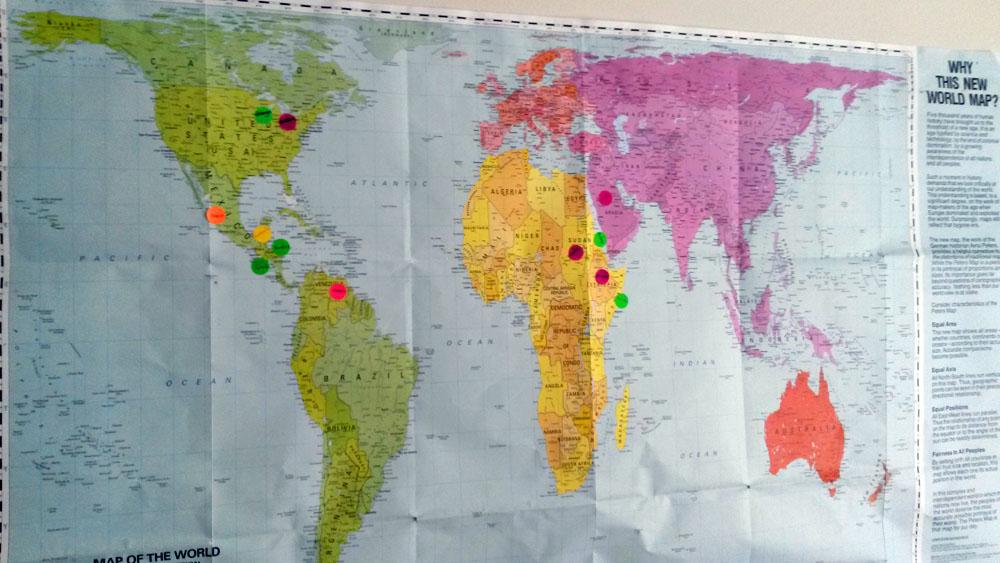 A map of the world in Bethany House of Hospitality in Bartlett, Illinois, features stickers that show the places of origin of those who live and work there. A map of the world in Bethany House of Hospitality in Bartlett, Illinois, features stickers that show the places of origin of those who live and work there.