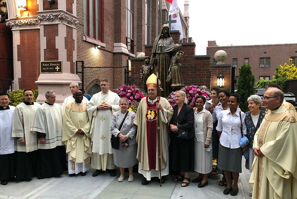 Bishop Nicholas DiMarzio stands with the members of the Missionary Sisters of the Sacred Heart of Jesus and others in attendance at the dedication of the new Mother Cabrini statue and shrine in the Carroll Gardens section of Brooklyn, New York. (Courtesy Bishop Nicholas DiMarzio stands with the members of the Missionary Sisters of the Sacred Heart of Jesus and others in attendance at the dedication of the new Mother Cabrini statue and shrine in the Carroll Gardens section of Brooklyn, New York. (Courtesy