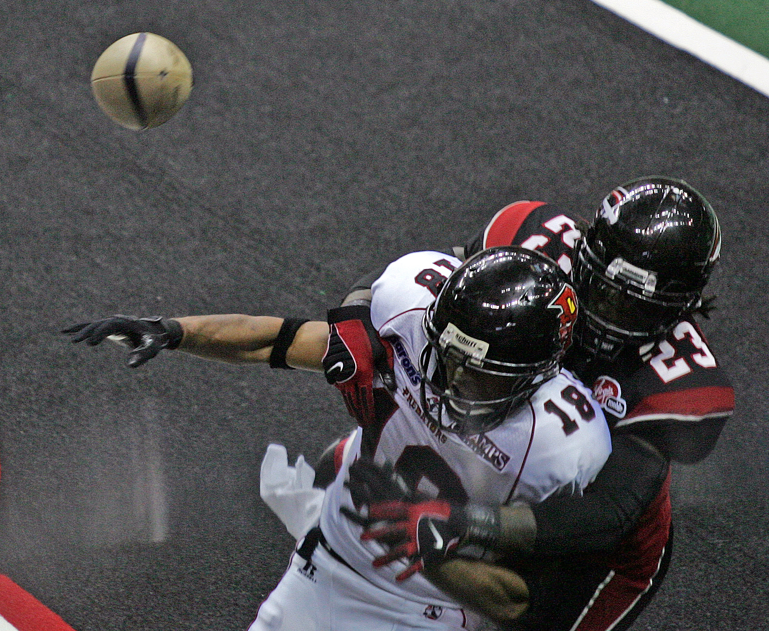 Alphonso Hodge (23) of the Gladiators breaks up a pass to Orlando player Kevin Nickerson (18) during a game at the Arena Football Playoffs at Quicken Loans Arena June 30, 2008 in Cleveland. Nickerson has served as Los Angeles Rams chaplain since 2016.