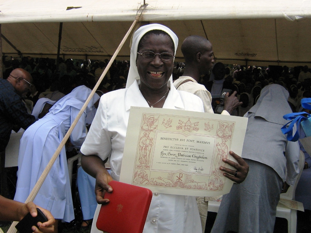 Sr. Patricia Ebegbulem holds her certificate at an award ceremony in 2012 where she received the Pro Ecclesia et Pontifice medal. (Provided photo) Sr. Patricia Ebegbulem holds her certificate at an award ceremony in 2012 where she received the Pro Ecclesia et Pontifice medal. (Provided photo)
