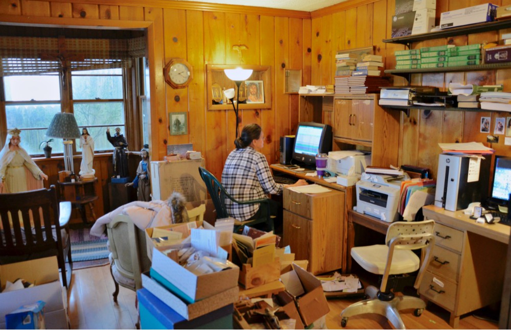 A volunteer works in the office of the Confraternity of Penitents in Fort Wayne, Indiana, a private association of the faithful featured in the 2017 edition of "Emerging U.S. Communities of Consecrated Life Since Vatican II." (GSR photo / Dan Stockman) A volunteer works in the office of the Confraternity of Penitents in Fort Wayne, Indiana, a private association of the faithful featured in the 2017 edition of "Emerging U.S. Communities of Consecrated Life Since Vatican II." (GSR photo / Dan Stockman)