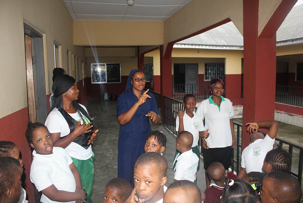 Sr. Scholastica Achinkumbur addresses students on the assembly ground at St. Vincent's Centre for Inclusive Education run by the Daughters of Charity of St. Vincent de Paul in Uyo, state capital of Akwa Ibom in Southern Nigeria. (Kelechukwu Iruoma) Sr. Scholastica Achinkumbur addresses students on the assembly ground at St. Vincent's Centre for Inclusive Education run by the Daughters of Charity of St. Vincent de Paul in Uyo, state capital of Akwa Ibom in Southern Nigeria. (Kelechukwu Iruoma)