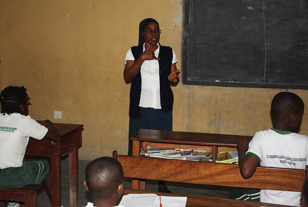 Sr. Martha Oko uses sign language to teach pupils at St. Vincent's Centre for Inclusive Education, run by the Daughters of Charity in Uyo, state capital of Akwa Ibom in Southern Nigeria. (Kelechukwu Iruoma) Sr. Martha Oko uses sign language to teach pupils at St. Vincent's Centre for Inclusive Education, run by the Daughters of Charity in Uyo, state capital of Akwa Ibom in Southern Nigeria. (Kelechukwu Iruoma)