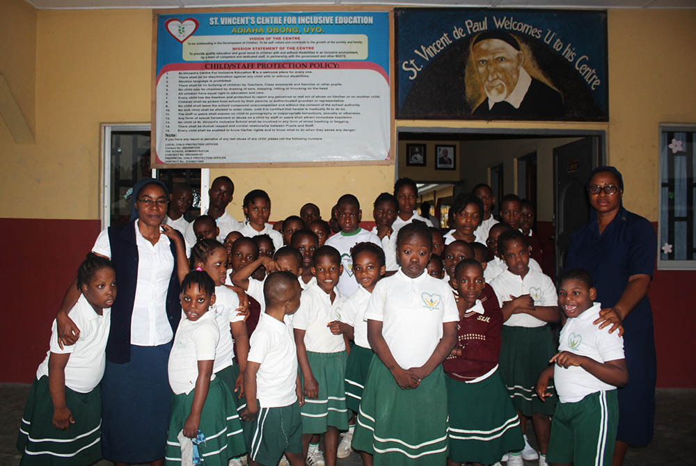 Daughters of Charity of Saint Vincent de Paul and children living with disabilities gather outside the school administration block in Uyo, state capital of Akwa Ibom in Southern Nigeria. (Kelechukwu Iruoma) Daughters of Charity of Saint Vincent de Paul and children living with disabilities gather outside the school administration block in Uyo, state capital of Akwa Ibom in Southern Nigeria. (Kelechukwu Iruoma)