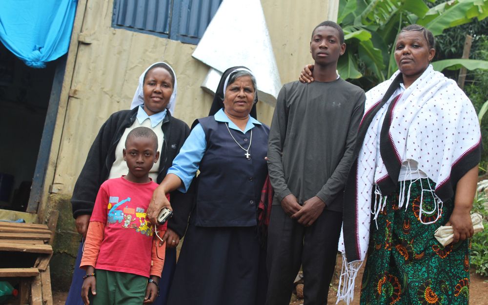 Paulina Masawe, right, who was pressured by her husband to relinquish her children to traffickers, and Stanley Joakim, second from right, stand with Catholic sisters and Stanley's younger brother in Arusha, Tanzania Paulina Masawe, right, who was pressured by her husband to relinquish her children to traffickers, and Stanley Joakim, second from right, stand with Catholic sisters and Stanley's younger brother in Arusha, Tanzania