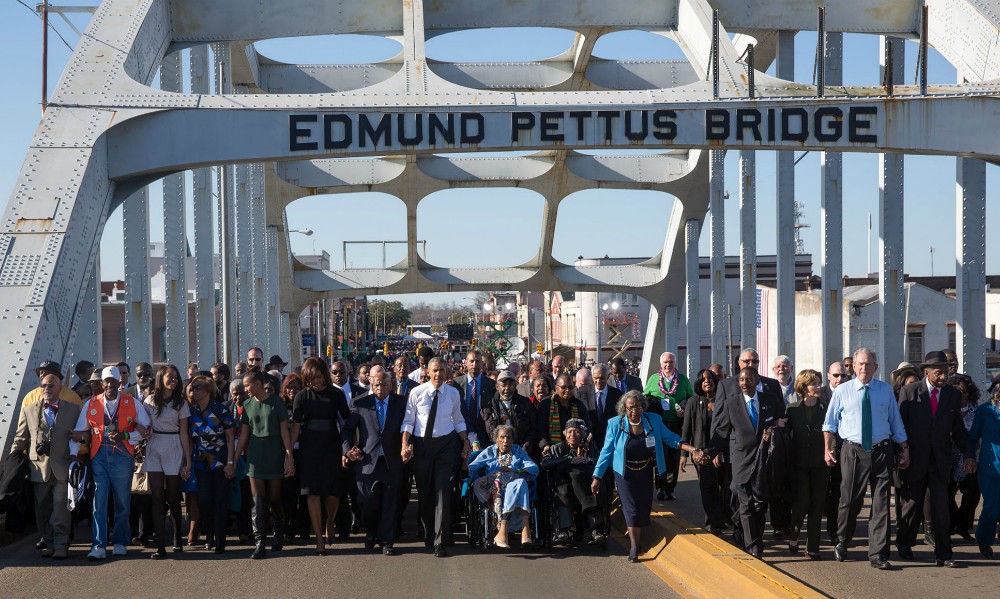 John Lewis walks between first lady Michelle Obama and President Barack Obama during a walk across Edmund Pettus Bridge to commemorate the 50th anniversary of the "Bloody Sunday" march from Selma to Montgomery, in Selma, Alabama, on March 7, 2015. John Lewis walks between first lady Michelle Obama and President Barack Obama during a walk across Edmund Pettus Bridge to commemorate the 50th anniversary of the "Bloody Sunday" march from Selma to Montgomery, in Selma, Alabama, on March 7, 2015.