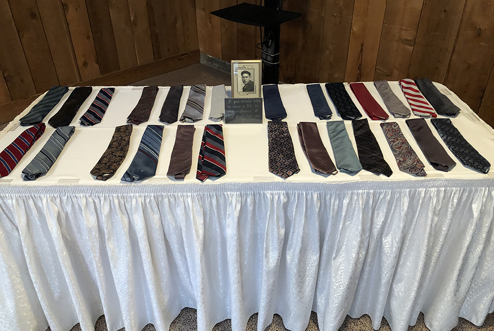 Ted George ties Ties that belonged to Ted George are displayed at the funeral gathering. One of the Indigenous leader's sons invited guests to carry home a tie if it "spoke" to them. (Courtesy of The Cedar Tree Institute)