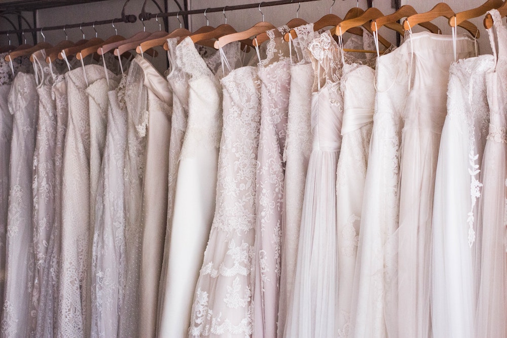 Wedding dresses hanging on a rack (Unsplash/Charisse Kenion) Wedding dresses hanging on a rack (Unsplash/Charisse Kenion)