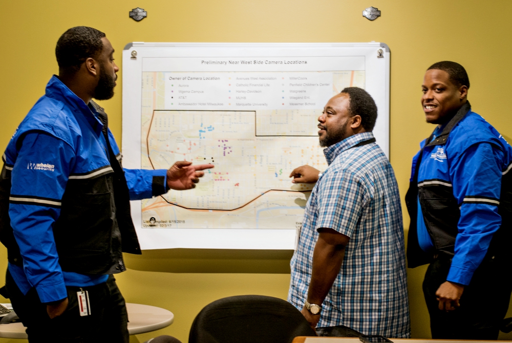 Community Prosecution Unit coordinator Bobby McQuay, center, and the Near West Side Partners ambassadors use geocoded data and resident input to address community identified issues on Milwaukee's Near West Side. (Courtesy of Near West Side Partners) Community Prosecution Unit coordinator Bobby McQuay, center, and the Near West Side Partners ambassadors use geocoded data and resident input to address community identified issues on Milwaukee's Near West Side. (Courtesy of Near West Side Partners)