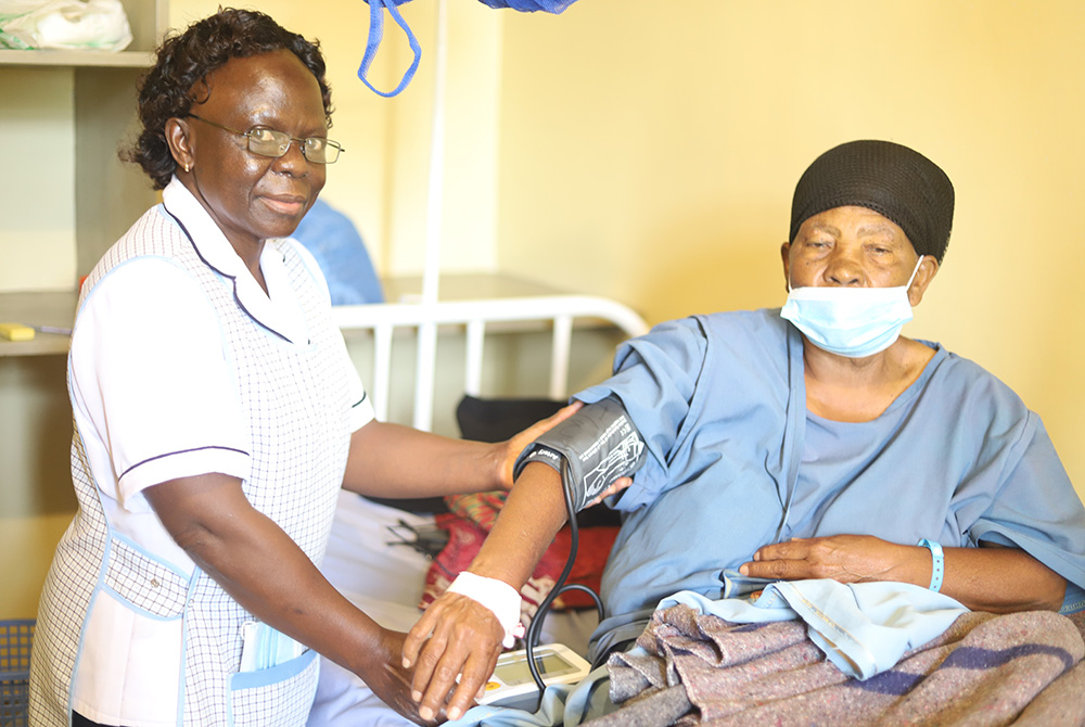 A nurse attends to a patient at St. Joseph Hospital June 2 in Gilgil in southwestern Kenya. After losing the first long court battle for the control of the hospitals in September 2017, Dr. William Fryda set up another hospital nearby St. Mary's Mission Ho A nurse attends to a patient at St. Joseph Hospital June 2 in Gilgil in southwestern Kenya. After losing the first long court battle for the control of the hospitals in September 2017, Dr. William Fryda set up another hospital nearby St. Mary's Mission Ho