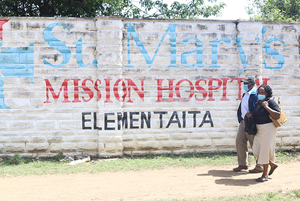 Patients seeking medical care walk towards the main entrance of St Mary's Mission Hospital Elementaita in Gilgil, in southwestern Kenya. This is a branch hospital of St. Mary’s Mission Hospital in Lang’ata, Nairobi. Patients of the hospitals say they are Patients seeking medical care walk towards the main entrance of St Mary's Mission Hospital Elementaita in Gilgil, in southwestern Kenya. This is a branch hospital of St. Mary’s Mission Hospital in Lang’ata, Nairobi. Patients of the hospitals say they are