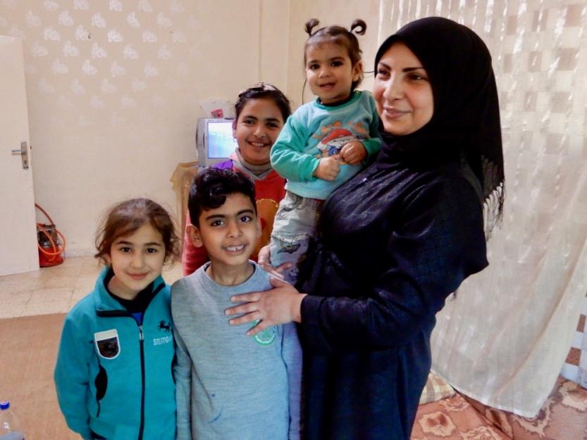Hanaa Abdullah poses with her children and her brother's children in her brother's apartment in Madaba, Jordan. Hanaa Abdullah poses with her children and her brother's children in her brother's apartment in Madaba, Jordan.