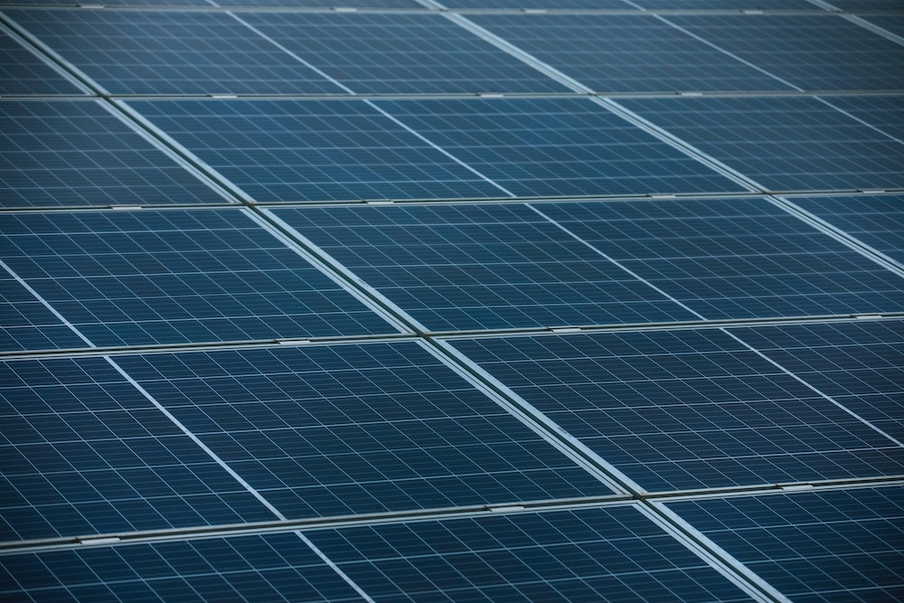 Solar panels in a photo illustration (Unsplash/Markus Spiske)