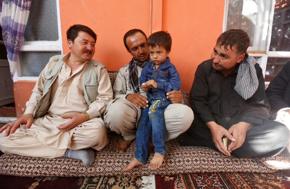 Ali Ahmad, 4, sits with his father and relatives at their house after he survived a suicide attack at a mosque in Kabul, Afghanistan, Aug. 27. (Newscom/Reuters/Omar Sobhani) Ali Ahmad, 4, sits with his father and relatives at their house after he survived a suicide attack at a mosque in Kabul, Afghanistan, Aug. 27. (Newscom/Reuters/Omar Sobhani)