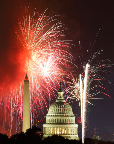 Fireworks light up the sky around the U.S. Capitol and Washington Monument on Independence Day in 2012. (CNS/Reuters)