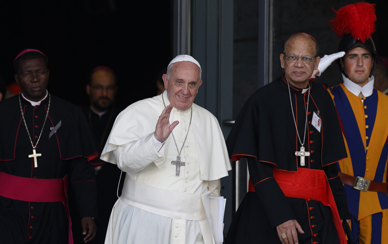 Pope Francis walks next to Indian Cardinal Oswald Gracias as he leaves the morning session of the 2014 Synod of Bishops on the family at the Vatican Oct. 9, 2014. (CNS/Paul Haring)