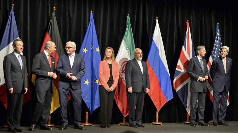 World leaders take part in a press conference July 14 after reaching a nuclear deal with Iran. From left are Chinese Foreign Minister Wang Yi; French Foreign Minister Laurent Fabius; German Foreign Minister Frank-Walter Steinmeier; Federica Mogherini, high representative of the European Union for foreign affairs and security policy; Iranian Foreign Minister Mohammad Javad Zarif; British Foreign Secretary Philip Hammond; and U.S. Secretary of State John Kerry. (CNS/Herbert Neubauer, EPA)