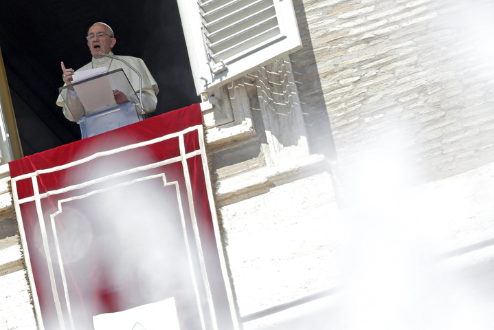 Pope Francis leads the Angelus from the window of his studio overlooking St. Peter's Square at the Vatican Aug. 30. (CNS/Max Rossi, Reuters)