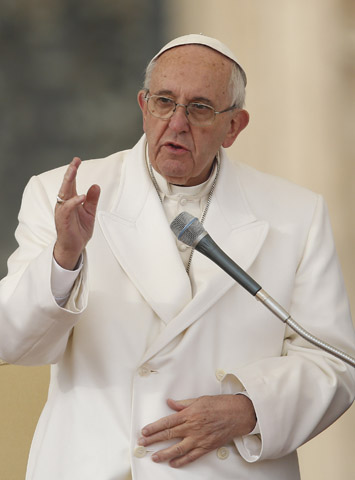 Pope Francis delivers his blessing during his general audience in St. Peter's Square at the Vatican Dec. 16. (CNS/Paul Haring)