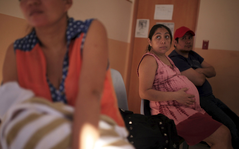 A pregnant woman waits to be seen Jan. 29 at the Women's National Hospital in San Salvador, El Salvador. (CNS/Jose Cabezas, Reuters)