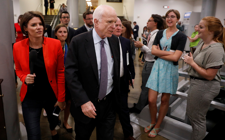 Sen. John McCain, R-Ariz., speaks with reporters ahead of a health care vote July 27 on Capitol Hill in Washington. (CNS/Aaron P. Bernstein, Reuters)