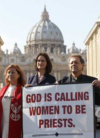 Janice Sevre-Duszynska, left, Miriam Duignan, and Maryknoll Father Roy Bourgeois demonstrate in support of women's ordination in Rome Oct. 17, 2011. (CNS/Paul Haring)