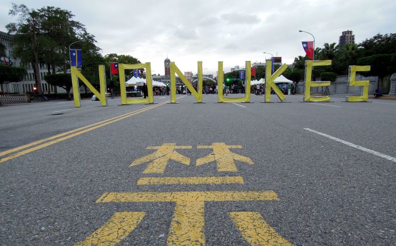A sign with the words "no nukes" is seen in front of the Presidential Office Building during an anti-nuclear protest March 3 in Taipei, Taiwan. (CNS photo/Henry Lin, EPA)