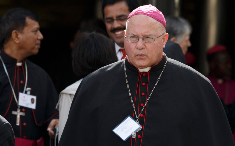 Bishop Brian J. Dunn of Antigonish, Nova Scotia, leaves a meeting of the Synod of Bishops on the new evangelization Tuesday at the Vatican. Dunn told the synod Friday the new evangelization must address the reality of distrust and disappointment caused by the sexual abuse scandal in the Catholic church. (CNS/Paul Haring)