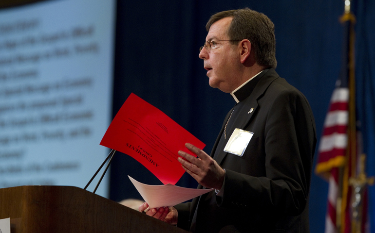 Archbishop Allen H. Vigneron of Detroit presents amendments to a proposed document on the economy -- one intended as a pastoral message of hope -- during the U.S. bishops annual fall meeting in Baltimore Tuesday. (CNS/Nancy Phelan Wiechec)