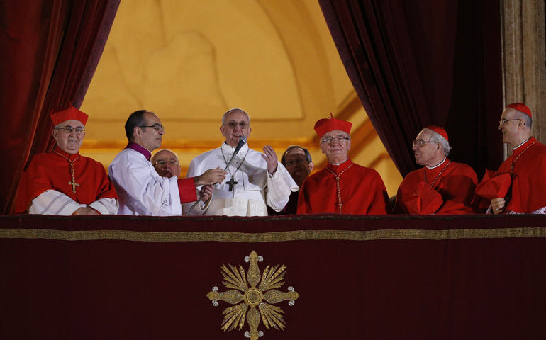Pope Francis addresses the world for the first time Wednesday from the central balcony of St. Peter's Basilica at the Vatican. Cardinal Jorge Mario Bergoglio of Argentina was elected the 266th Roman Catholic pontiff. (CNS/Paul Haring)