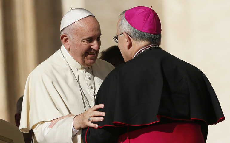 Pope Francis talks with Archbishop Charles Chaput of Philadelphia during his general audience Wednesday in St. Peter's Square at the Vatican. (CNS/Paul Haring)